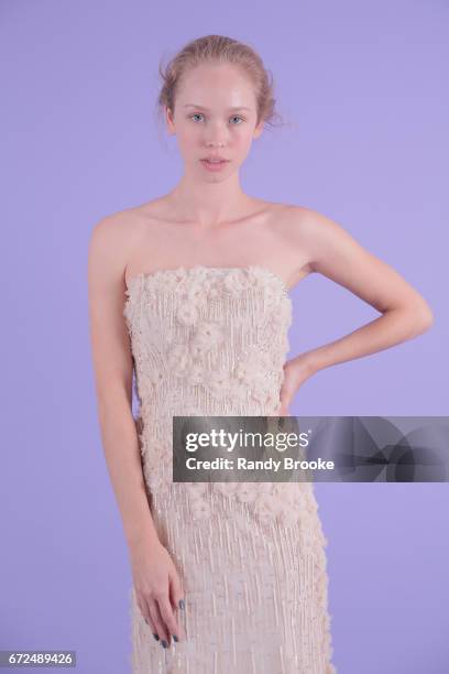 Model poses on seamless paper at the Isabelle Armstrong Spring 2018 bridal presentation during New York Fashion Week: Bridal April 2017 at The London...