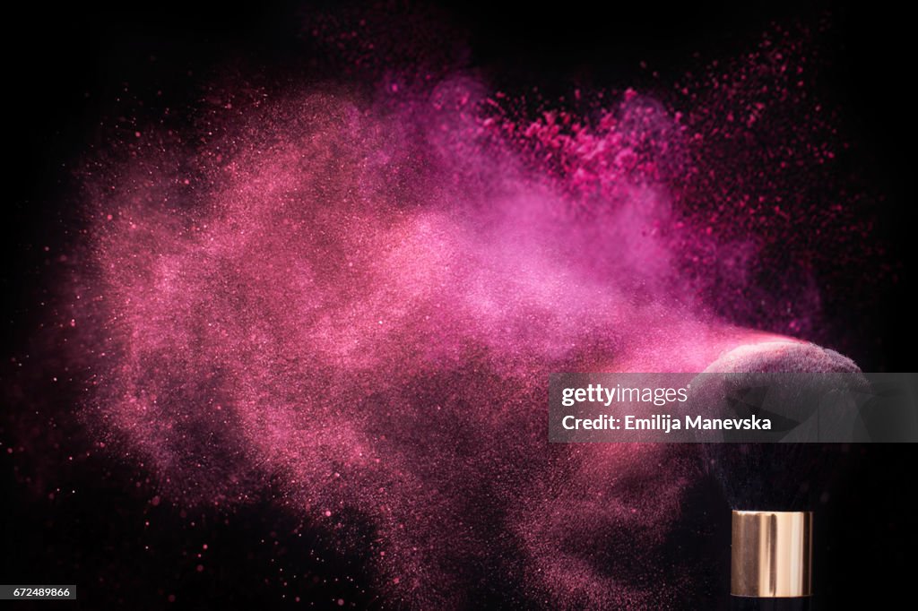 Pink colored face powder exploding