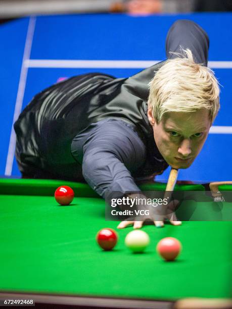 Neil Robertson of Australia plays a shot during his second round match against Marco Fu of Chinese Hong Kong on day ten of Betfred World Championship...