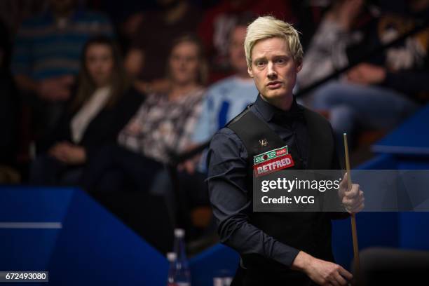 Neil Robertson of Australia reacts during his second round match against Marco Fu of Chinese Hong Kong on day ten of Betfred World Championship 2017...