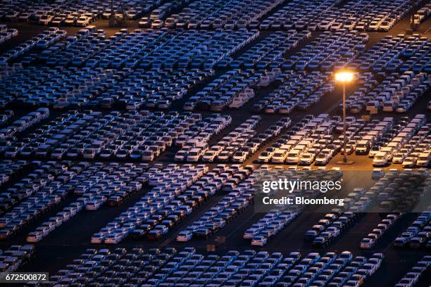 Hyundai Motor Co. Vehicles bound for export await shipment at the company's Ulsan plant at dusk in Ulsan, South Korea, on Sunday, April 23, 2017....