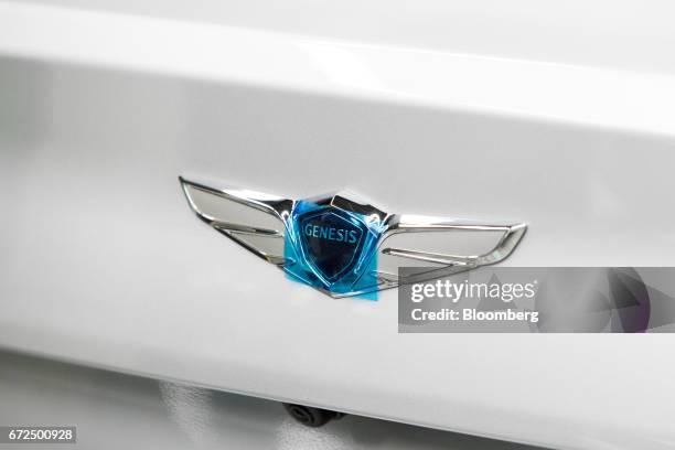 Covered Hyundai Motor Co. Genesis badge is seen on the trunk of the luxury sedan on the production line at the company's plant in Ulsan, South Korea,...