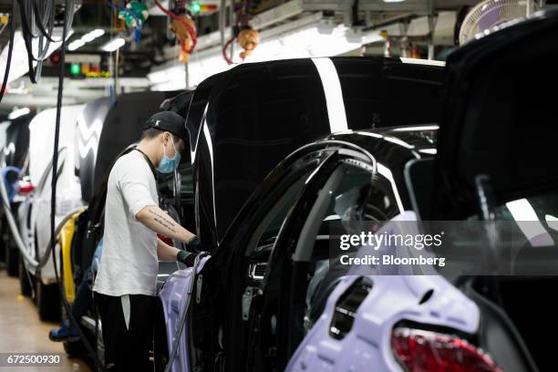 An employee assembles a Hyundai Motor Co. Genesis luxury sedan on the production line at the company's plant in Ulsan, South Korea, on Monday, April...