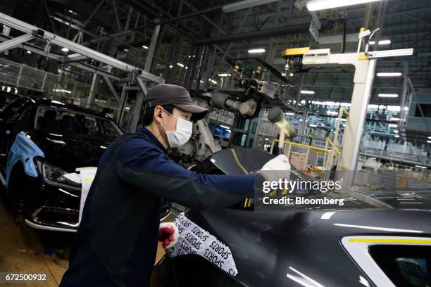 An employee assembles a Hyundai Motor Co. Genesis luxury sedan on the production line at the company's plant in Ulsan, South Korea, on Monday, April...