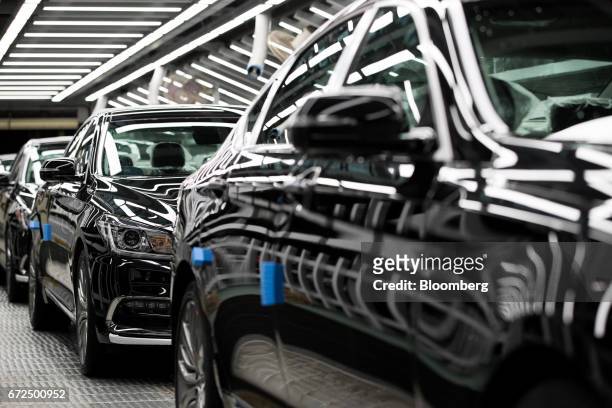 Hyundai Motor Co. Genesis luxury sedans move along a conveyor belt on the production line at the company's plant in Ulsan, South Korea, on Monday,...