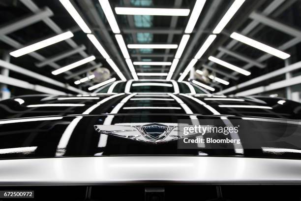 The Hyundai Motor Co. Genesis badge is seen on the hood of the sedan on the production line at the company's plant in Ulsan, South Korea, on Monday,...