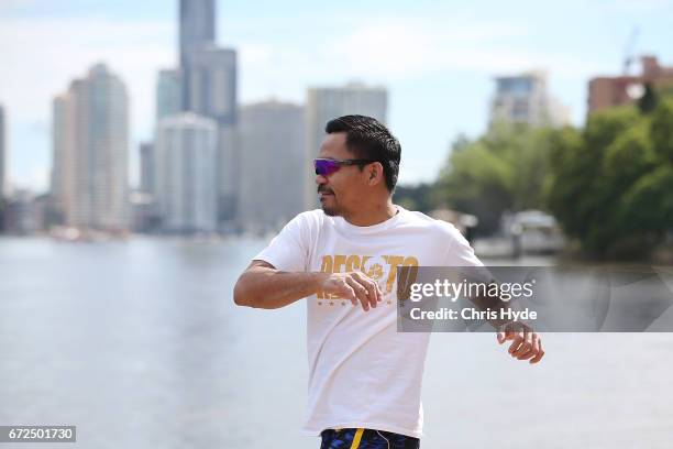 Manny Pacquiao stretches during a visit to Kangaroo Point. Pacquiao is in Australia to promote his upcoming fight with Australian Jeff Horn on April...