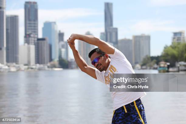 Manny Pacquiao stretches during a visit to Kangaroo Point. Pacquiao is in Australia to promote his upcoming fight with Australian Jeff Horn on April...