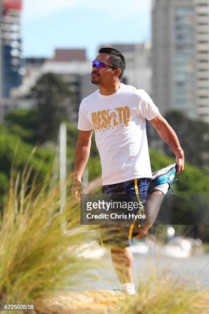 Manny Pacquiao stretches during a visit to Kangaroo Point. Pacquiao is in Australia to promote his upcoming fight with Australian Jeff Horn on April...