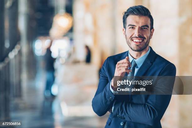 smiling confident businessman - lawyers stock pictures, royalty-free photos & images