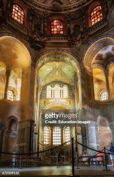 Ravenna, Ravenna Province, Italy, Visitors admiring mosaics in San Vitale basilica, The basilica was begun in the 6th century and is one of eight...