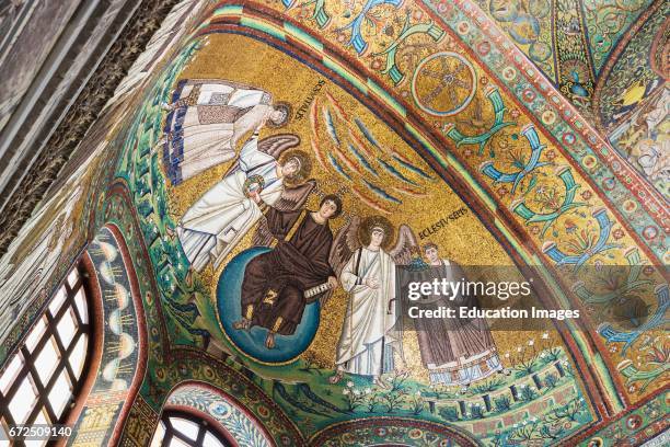 Ravenna, Ravenna Province, Italy, Mosaic in apse of San Vitale of Christ flanked by two angels and St Vitalis and Bishop Ecclesius, Christ is handing...