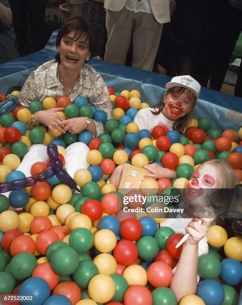 Cherie Blair in a ball pool at the launch of a charity week in support of kids clubs, United Kingdom, 24th June 1999.