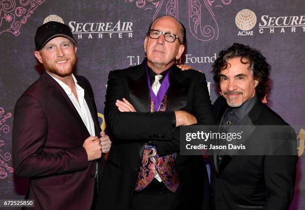 Singer-songwriter Cole Swindell, John Esposito of Warner Music Nashville, and musician John Oates attend Best Cellars Wine Dinner hosted by T.J....