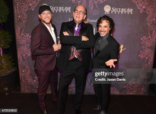 Singer-songwriter Cole Swindell, John Esposito of Warner Music Nashville, and musician John Oates attend Best Cellars Wine Dinner hosted by T.J....