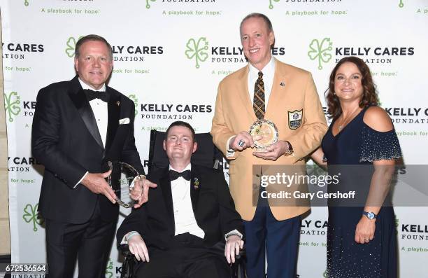 Founders of The Kelly Cares Foundation, Brian Kelly and Paqui Kelly and event honorees Patrick Quinn and Jim Kelly attend the 2017 Kelly Cares...