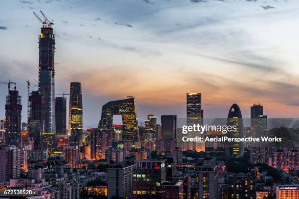 beijing central business district at dusk - cctv headquarters stock pictures, royalty-free photos & images