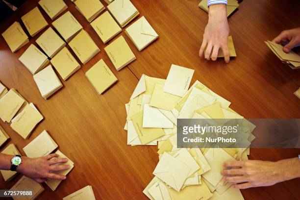 Volunteers count the ballots at the end of the first round of the French presidential election first round vote in Toulouse, France on April 23,...