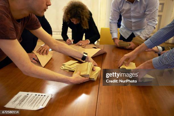 Volunteers count the ballots at the end of the first round of the French presidential election first round vote in Toulouse, France on April 23,...