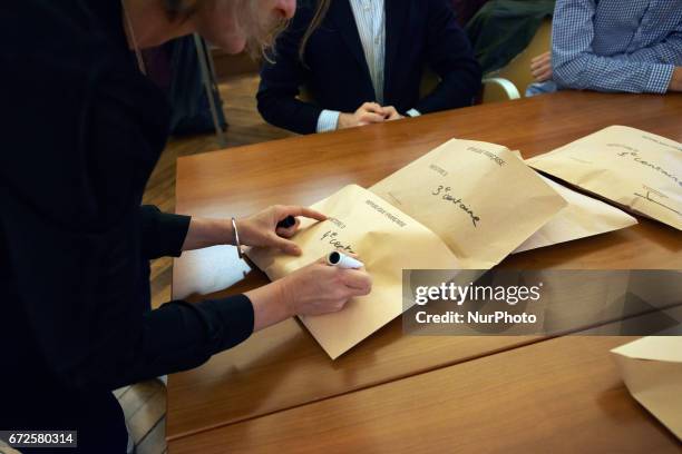 Volunteers count the ballots at the end of the first round of the French presidential election first round vote in Toulouse, France on April 23,...