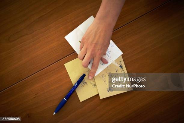 Volunteers count the ballots at the end of the first round of the French presidential election first round vote in Toulouse, France on April 23,...