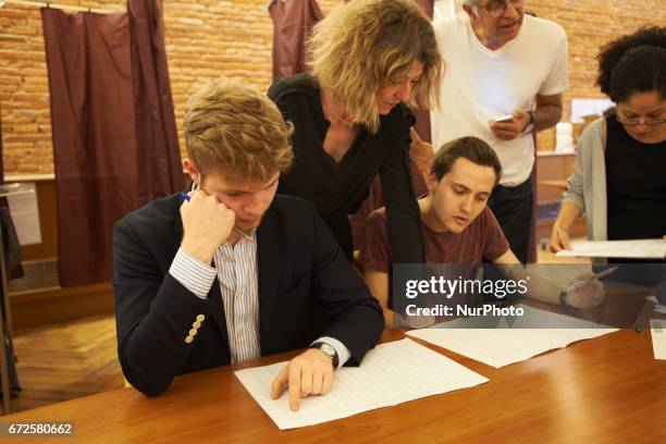 Volunteers count the ballots at the end of the first round of the French presidential election first round vote in Toulouse, France on April 23,...