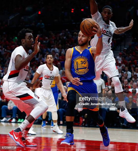 Stephen Curry of the Golden State Warriors drives with the ball over against the Portland Trail Blazers during Game Three of the Western Conference...