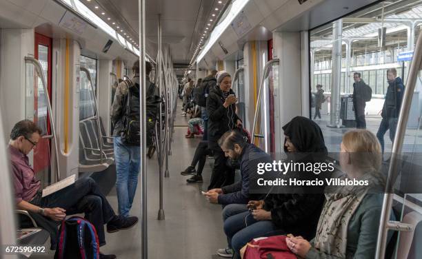 Passengers ride the Metro on April 20, 2017 in Amsterdam, Netherlands. The city's Metro system was first introduced in 1977. It is a fast way of...