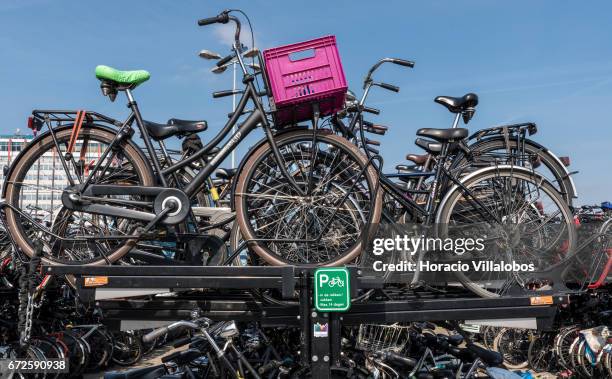 Bicycle parking facility outside the Central Station on April 20, 2017 in Amsterdam, Netherlands. Amsterdam is both the most bicycle-friendly capital...