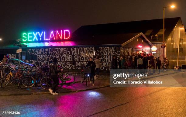 People queue to get into Sexyland night club at NDSM on April 22, 2017 in Amsterdam, Netherlands.