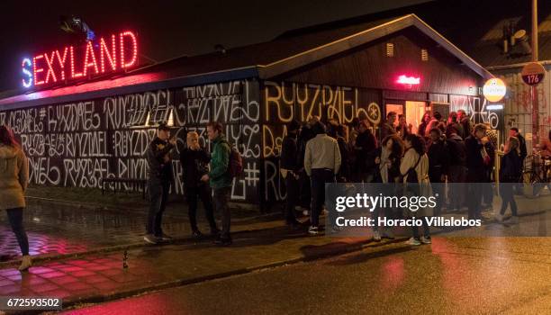 People queue to get into Sexyland night club at NDSM on April 22, 2017 in Amsterdam, Netherlands.