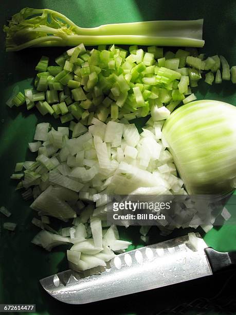 diced onion and celery with knife - mirepoix comida fotografías e imágenes de stock