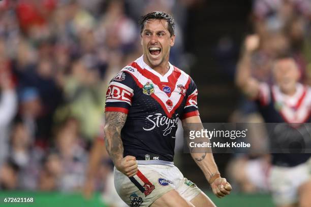 Mitchell Pearce of the Roosters celebrates kicking a field goal to claim golden point victory during the round eight NRL match between the Sydney...