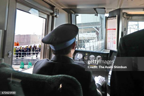 Train runs past the accident site on the twelveth anniversary of the train derailment accident on April 25, 2017 in Amagasaki, Hyogo, Japan. The...