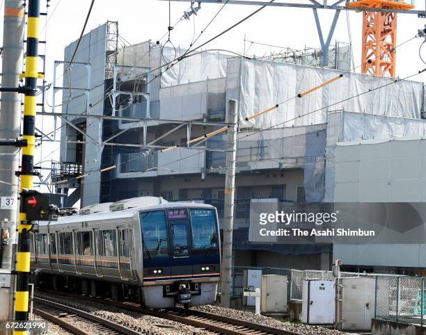Train runs past the accident site on the twelveth anniversary of the train derailment accident on April 25, 2017 in Amagasaki, Hyogo, Japan. The...