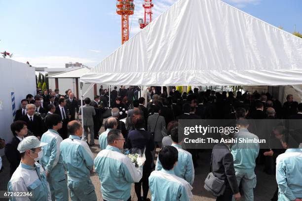 Bereaved family members offer payers at an altar during the memorial ceremony on the twelveth anniversary of the train derailment accident on April...