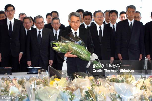 West President Tatsuo Kijima offers a flower at an altar set up at the accident site on the twelveth anniversary of the train derailment accident on...