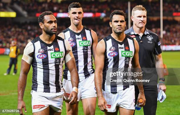 Travis Varcoe, Scott Pendlebury, Daniel Wells and Nathan Buckley of the Magpies look dejected after losing the round five AFL match between the...