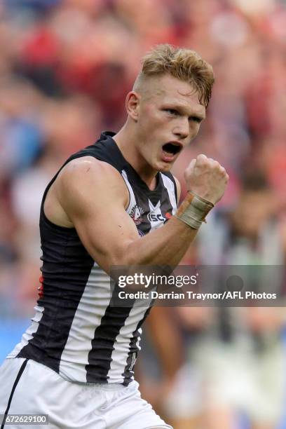 Adam Treloar of the Magpies celebrates a goal during the round five AFL match between the Essendon Bombers and the Collingwood Magpies at Melbourne...