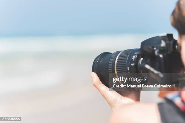 woman taking photos - photojournalist stock pictures, royalty-free photos & images