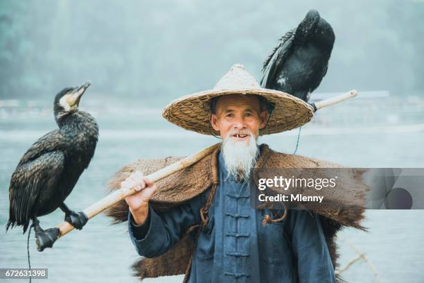 river lee chinese cormorant fisherman real people portrait li river china - tribal head gear in china stock pictures, royalty-free photos & images