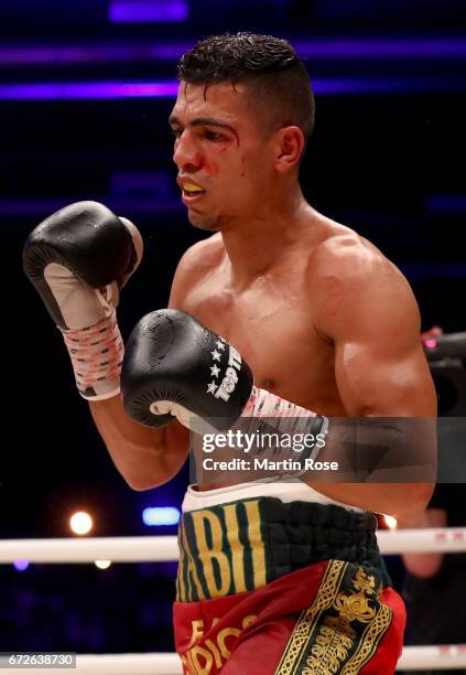 Mohammed Rabii of Morocco in action against Jean Pierre Habimana of Belgium during their super welterweight fight at Messehalle Erfurt on April 22,...