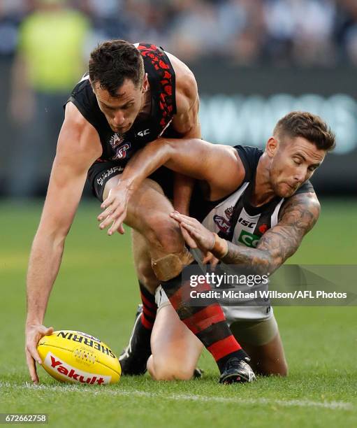 Matthew Leuenberger of the Bombers and Jeremy Howe of the Magpies in action during the 2017 AFL round 05 ANZAC Day match between the Essendon Bombers...