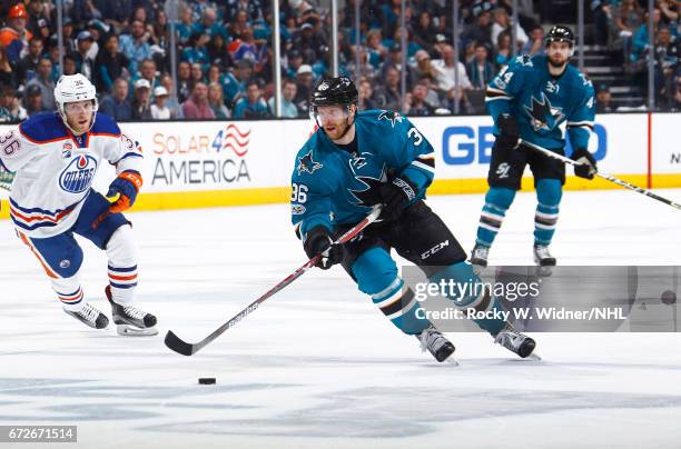 Jannik Hansen of the San Jose Sharks skates with the puck againt the Edmonton Oilers in Game Six of the Western Conference First Round during the...