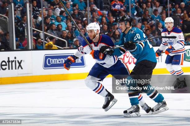 Zack Kassian of the Edmonton Oilers skates against Marcus Sorensen of the San Jose Sharks in Game Six of the Western Conference First Round during...