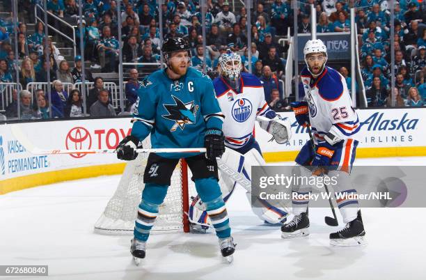 Joe Pavelski of the San Jose Sharks skates against Cam Talbot and Darnell Nurse of the Edmonton Oilers in Game Six of the Western Conference First...