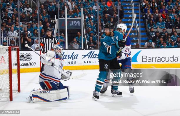 Cam Talbot and Darnell Nurse of the Edmonton Oilers defend the net against Joe Pavelski of the San Jose Sharks in Game Six of the Western Conference...