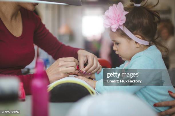 manicure for girls - beauty contest stock pictures, royalty-free photos & images