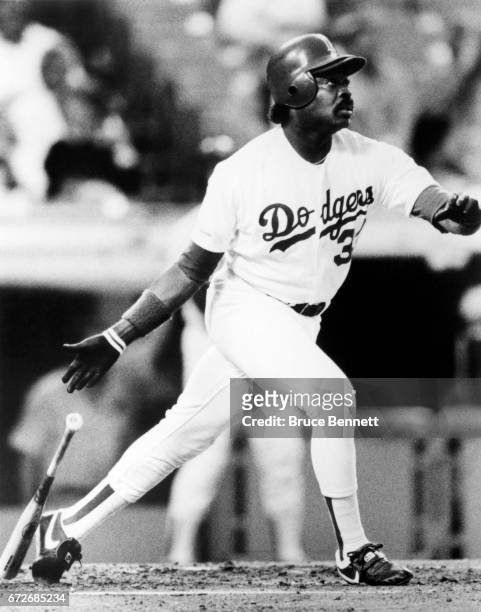 Eddie Murray of the Los Angeles Dodgers swings at a pitch during an MLB game circa 1990 at Dodger Stadium in Los Angeles, California.