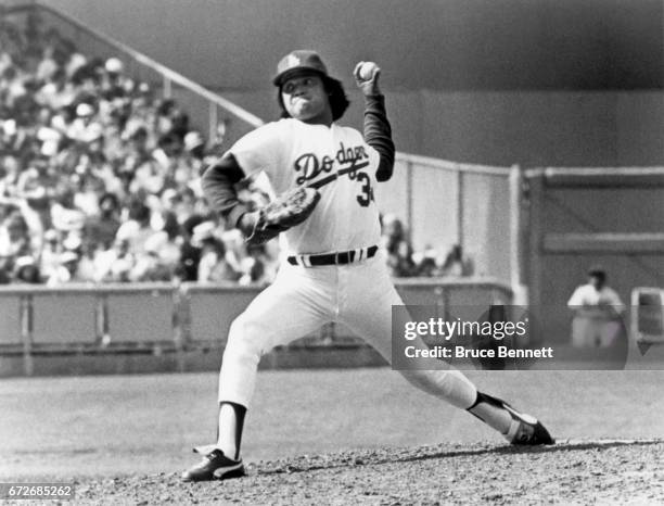 Pitcher Fernando Valenzuela of the Los Angeles Dodgers pitches during an MLB game circa 1980 at Dodger Stadium in Los Angeles, California.
